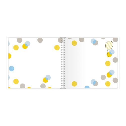 Offenes Notizbuch mit bunten Punkten und einer einzelnen Ballongrafik auf der rechten Seite.