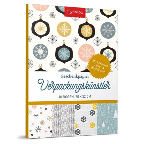 Ein festliches Geschenkpapierpaket mit Schneeflocken- und Ornamentmotiven mit der Aufschrift „Verpackungskünstler“.