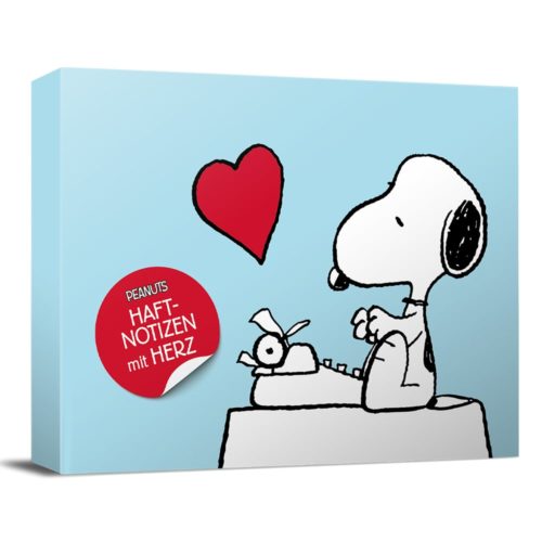 Snoopy tippt auf einer Schreibmaschine mit einem roten Herz darüber und einem Aufkleber mit der Aufschrift „Haft-Notizen mit Herz“.