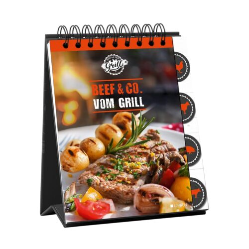 Spiralgebundenes Kochbuch mit dem Titel „Beef & Co. Vom Grill“ mit gegrilltem Fleisch und Gemüse auf dem Cover.