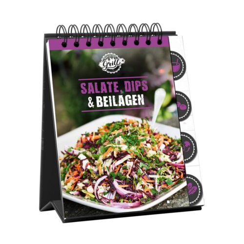 Spiralgebundenes Kochbuch mit einem bunten Salat auf dem Cover und dem Text „Salate, Dips & Beilagen“.