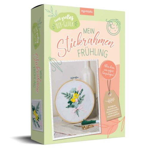 Stickset-Box zum Selbermachen mit einem floralen Frühlingsdesign in einem Rahmen auf der Vorderseite.