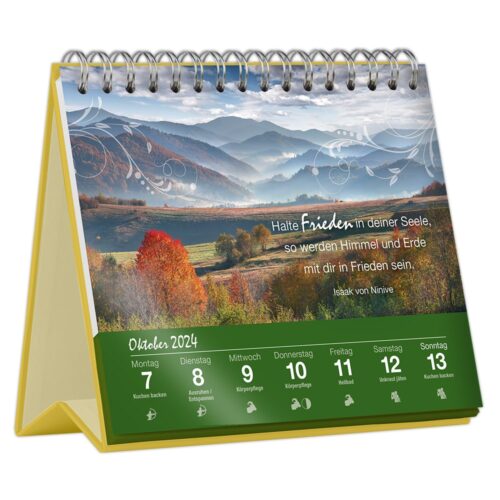 Tischkalender mit einer malerischen Landschaft für Oktober 2024, mit Herbstlaub und Bergen im Hintergrund.