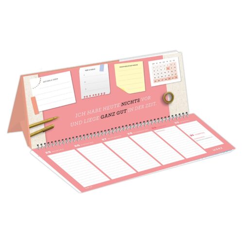 Ein rosa Tischkalender mit Notizen, kleinem Kalendarium und deutschem Text.