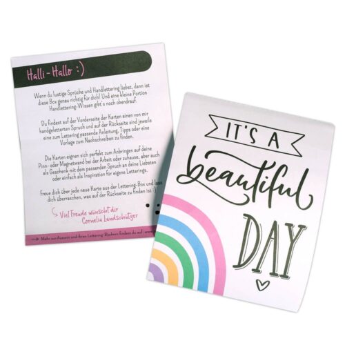 Zwei Grußkarten: eine mit deutschem Text, eine weitere mit „It’s a beautiful day“ und einem Regenbogenmotiv.